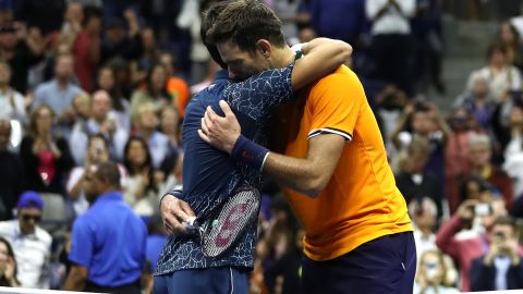 Novak Djokovic and Juan Martin del Potro exchange a hug. 