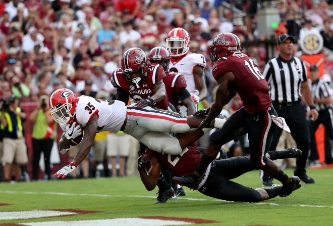 Rashad Fenton of the South Carolina Gamecocks watches as Brian Herrien of the Georgia Bulldogs drives for a touchdown during their game at Williams-Brice Stadium on Saturday, September 8, in Columbia, South Carolina.