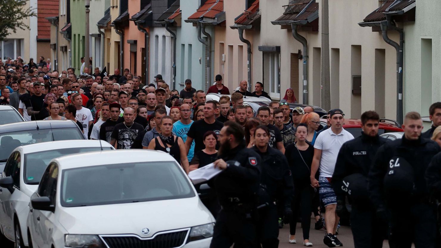 People take part in a march in Koethen, eastern Germany, on Sunday.