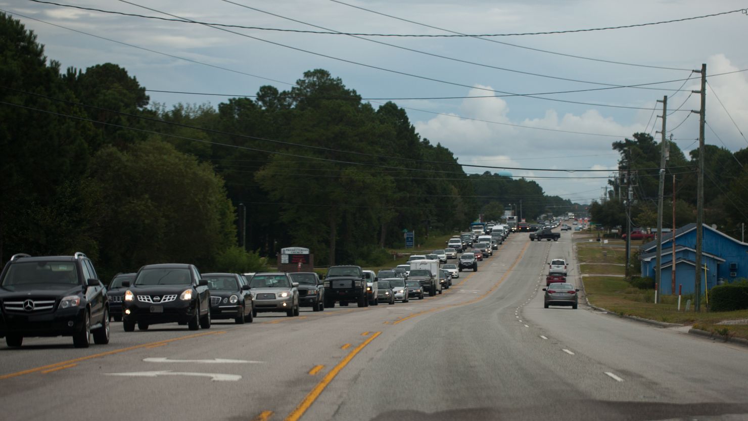 Vehicles line up along State Route 17 in Hampstead, North Carolina, as people evacuate the coast on September 11, 2018.