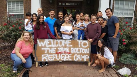 Leah Van Buren Bolton (standing, fifth from right) opened her Tennessee house last year to 26 people evacuating from Hurricane Irma.
