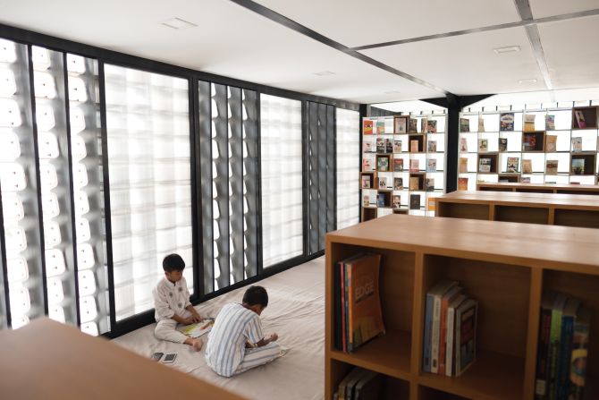 The Taman Bima library is the first in a series of small libraries in Indonesia built with a facade made of recycled ice-cream buckets, an easily available and cost-effective building material.