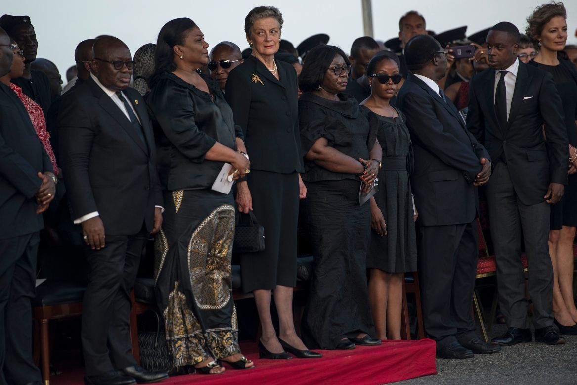 Annan's widow Nane Maria Annan (4thL) standing with other family members as Annan's body is welcome and the President of Ghana Nana Akufo-Addo. 