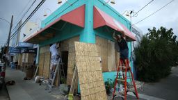 WRIGHTVILLE BEACH, NC - SEPTEMBER 11:  Workers board up the Wrightsville Beach Art Co. while preparing for the arrival of Hurricane Florence on September 11, 2018 in Wrightsville Beach, United States. Hurricane Florence is expected on Friday possibly as a category 4 storm along the Virginia, North Carolina and South Carolina coastline.  (Photo by Mark Wilson/Getty Images)