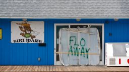 A Tiki bar sits empty with the message "FLO AWAY" September 11, 2018 on Topsail Island, North Carolina, where homes and businesses have boarded up and left for higher ground before the arrival of of Hurricane Florence. (Photo by Logan Cyrus / AFP)        (Photo credit should read LOGAN CYRUS/AFP/Getty Images)