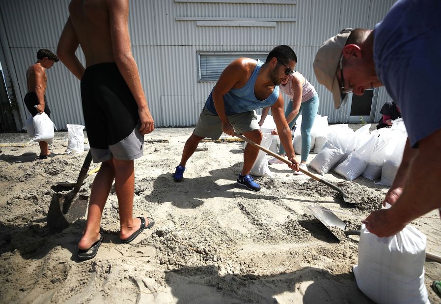 People fill sandbags in Wrightsville Beach, North Carolina, on September 11.