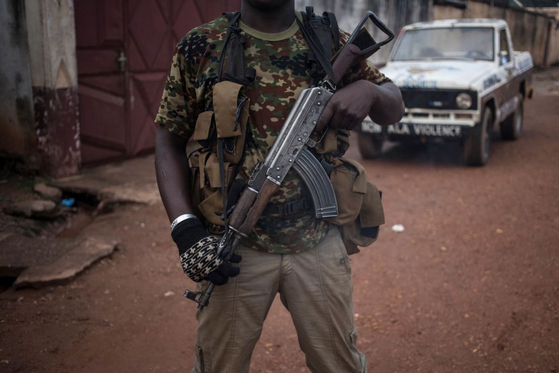 An armed militiaman stands guard in the majority Muslim district of Bangui, Central African Republic.