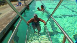 Vivian Stancil, 71, swims at a pool in Riverside, California. She first learned to swim when she was 50. 