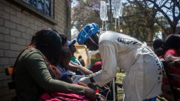 A nurse takes care of cholera patients at the cholera treatment center of the Beatrice Infectious Diseases Hospital, in Harare, on September 11, 2018.