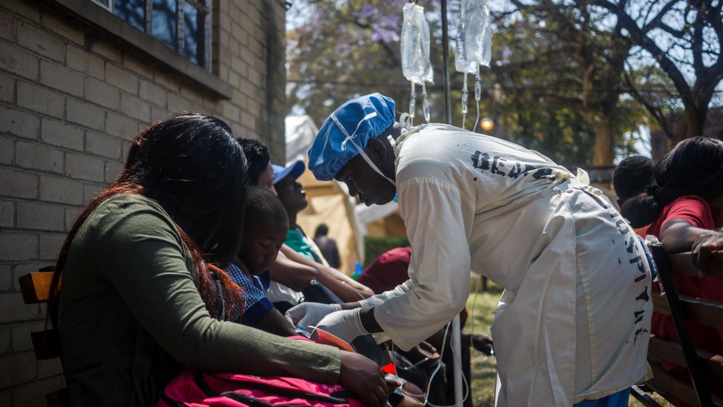 A nurse attends to patients at the cholera treatment center of the Beatrice Infectious Diseases Hospital in Harare in Zimbabwe on September 11, 2018.