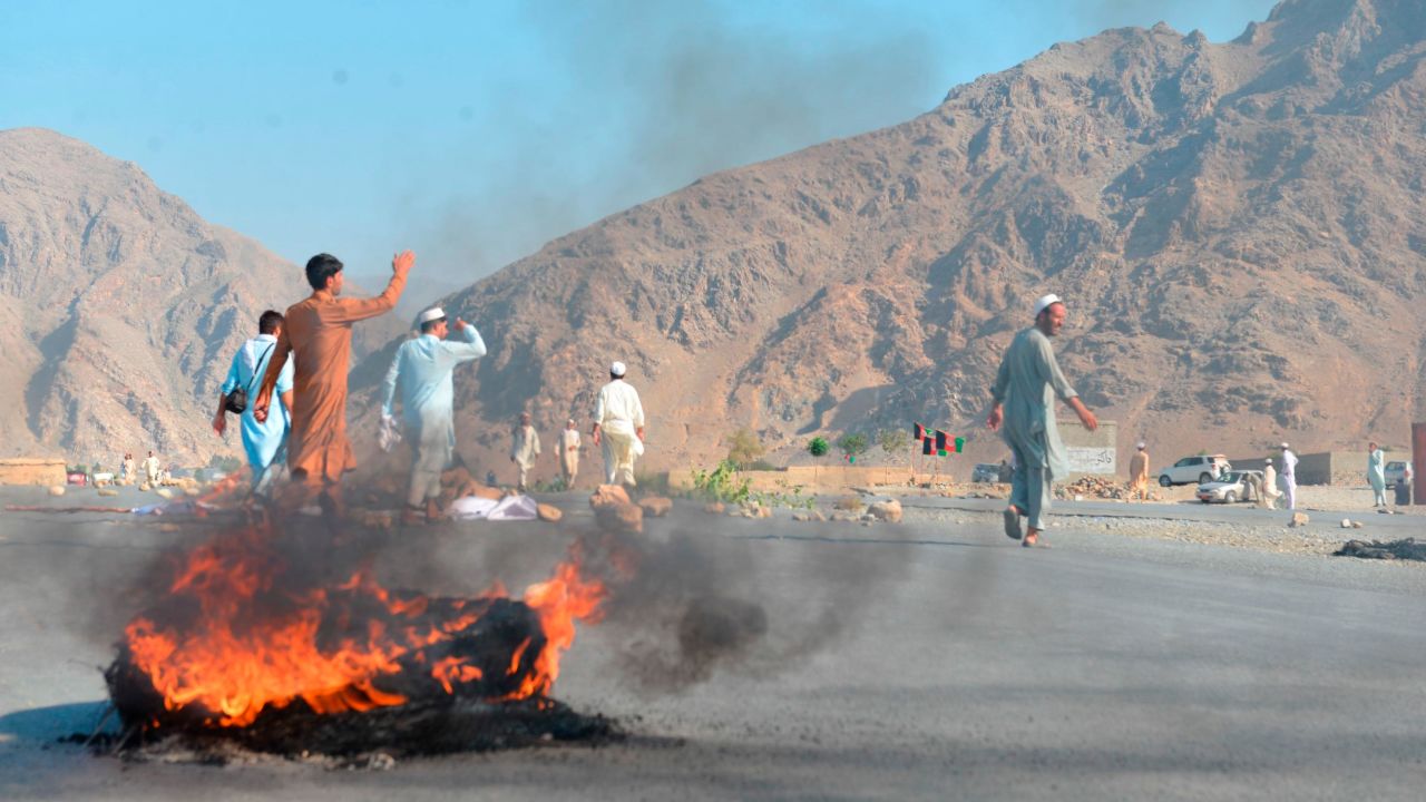 Men shout slogans against terrorists after a suicide attack among the protesters in Momandara district of Nangarhar province, Afghanistan, Tuesday, Sept. 11, 2018.