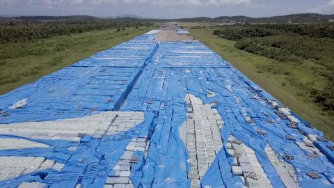 Stacks upon stacks of bottled water sit near a runway in Ceiba this month.
