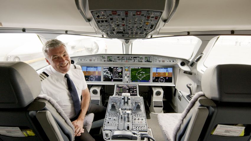 airBaltic chief pilot Gerhard Ramcke in the cockpit of an Airbus A220-300 