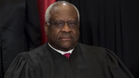 US Supreme Court Associate Justice Clarence Thomas sits for an official photo.