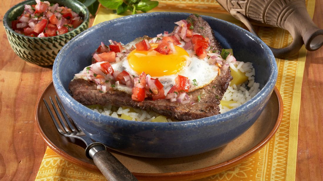 <strong>Bolivia: </strong>Silpancho brings together rice and potatoes with meats, a fried egg and salsa.