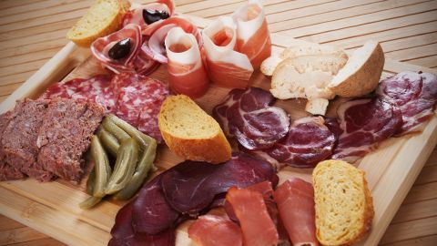Charcuterie board with cured meat, bread and olives; Shutterstock ID 582160330; Job: -