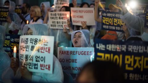 Anti-immigration activists attend a protest against a group of Yemen asylum seekers, Seoul, June 30, 2018.