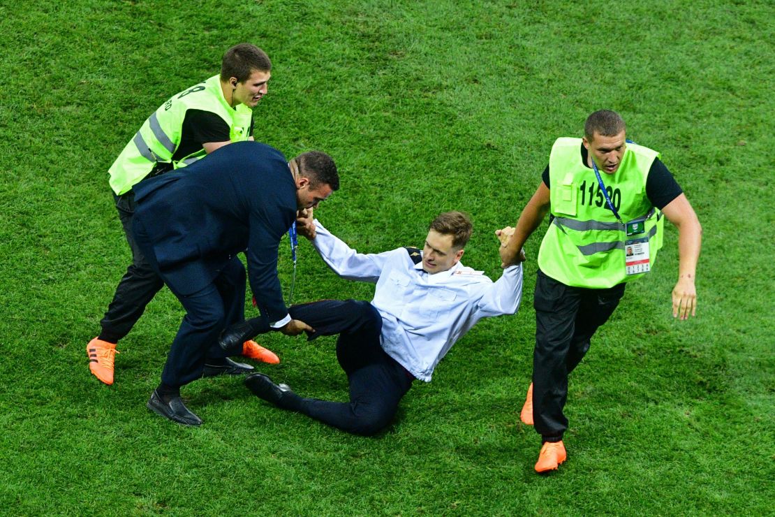 Pytor Verzilov is seen being dragged off the field during the World Cup final in July.