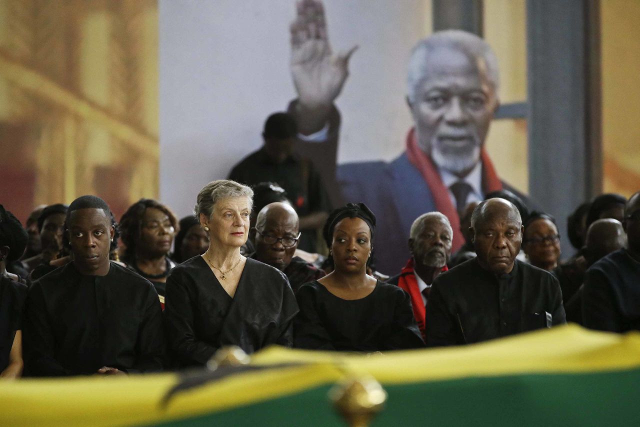 From left, Annan's son, Kojo Annan, his widow, Nane Annan, and daughter Ama Annan Adedeji join other family members as the late diplomat's coffin lies in state September 12 at the conference center.