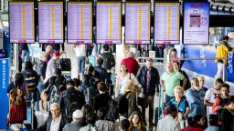 Passengers wait in the departure area at Schiphol Airport, as it breaks a record with 230,000 passengers travelling through the facilities in one day on July 31, 2017.  / AFP PHOTO / ANP / Bart MAAT / Netherlands OUT        (Photo credit should read BART MAAT/AFP/Getty Images)