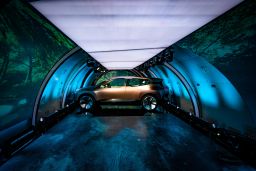 The concept car was unveiled inside a cargo jet that traveled to four cities in five days.