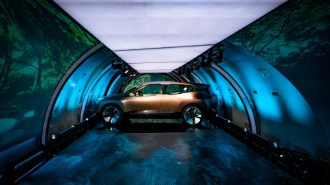 The concept car was unveiled inside a cargo jet that traveled to four cities in five days.