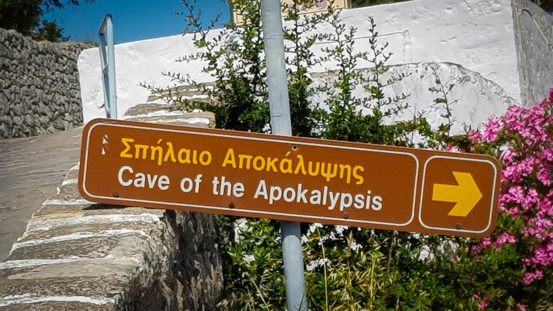 <strong>Holy cave:</strong> A sign pointing to the Cave of the Apocalypse, the grotto where biblical figure St. John is said to have had a vision that inspired the Book of Revelation.