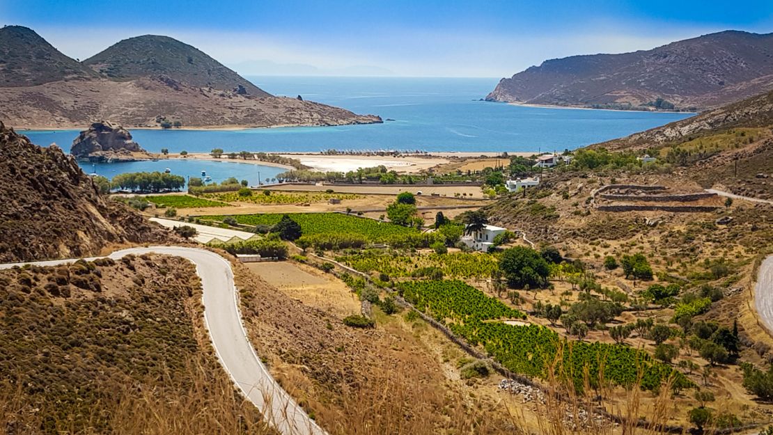 Petra beach lies beyond some of the islands' vineyards. 