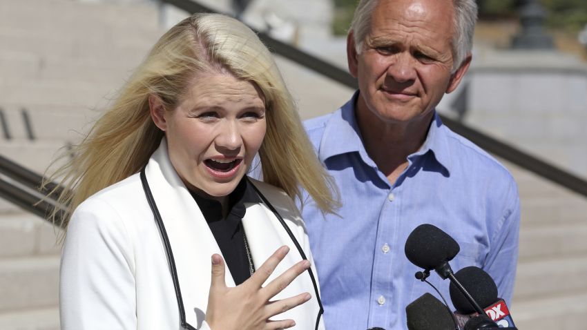 Elizabeth Smart speaks during a news conference while her father Ed Smart looks on Thursday, Sept. 13, 2018, in Salt Lake City. Smart says it appears there is no viable, legal recourse she can take to stop the release of one of her kidnappers. Smart said at a news conference Thursday in Salt Lake City that she only found out about 72-year-old Wanda Barzee's release shortly before the public did.