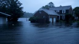 RIVER BEND, NC - SEPTEMBER 13:  The Trent River (background) overflows its banks and floods a neighborhood during Hurricane Florence September 13, 2018 in River Bend, North Carolina. Some parts of River Bend and the neighboring New Bern could be flooded with a possible 9-foot storm surge as the Category 2 hurricane approaches the United States.  (Photo by Chip Somodevilla/Getty Images)