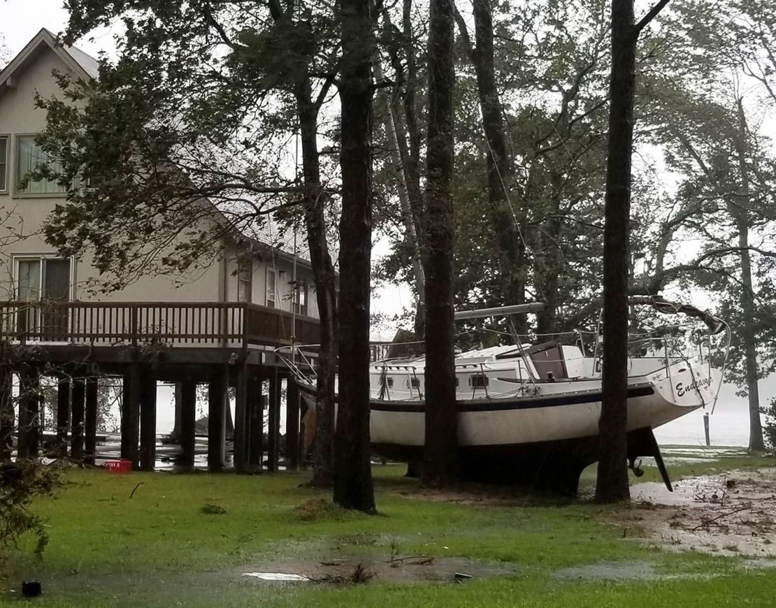 A boat is wedged in trees Friday in Oriental, North Carolina, in a photo from Angie Propst.