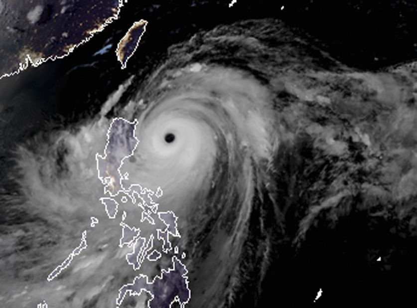 A satellite image shows the width and trajectory of Mangkhut as it approaches the Philippines on September 14.