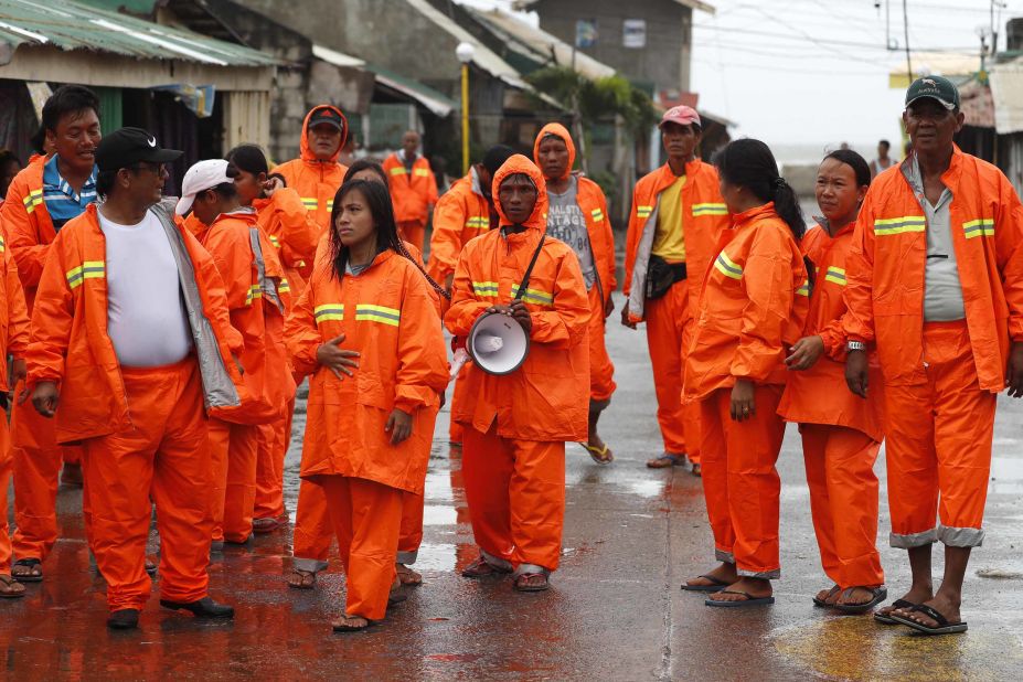 Officials conduct a patrol in Aparri ahead of the typhoon on September 14.