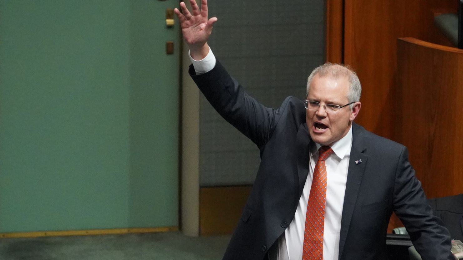 Australian Prime Minister Prime Minister Scott Morrison during Question Time in the House of Representatives at Parliament House on Thursday, getting his hands up.