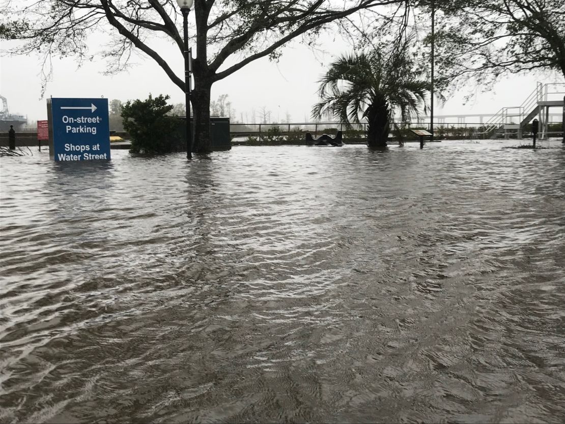 An area in downtown Wilmington, North Carolina,  usually meant for street parking and relaxing on park benches is inundated by water from the swollen Cape Fear River. 
