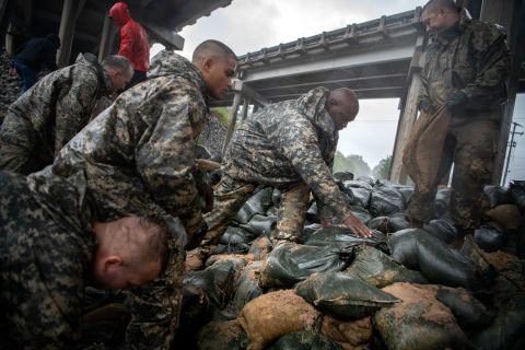 Soldiers from the North Carolina National Guard reinforce a low-lying area with sandbags in Lumberton, North Carolina, on September 14.