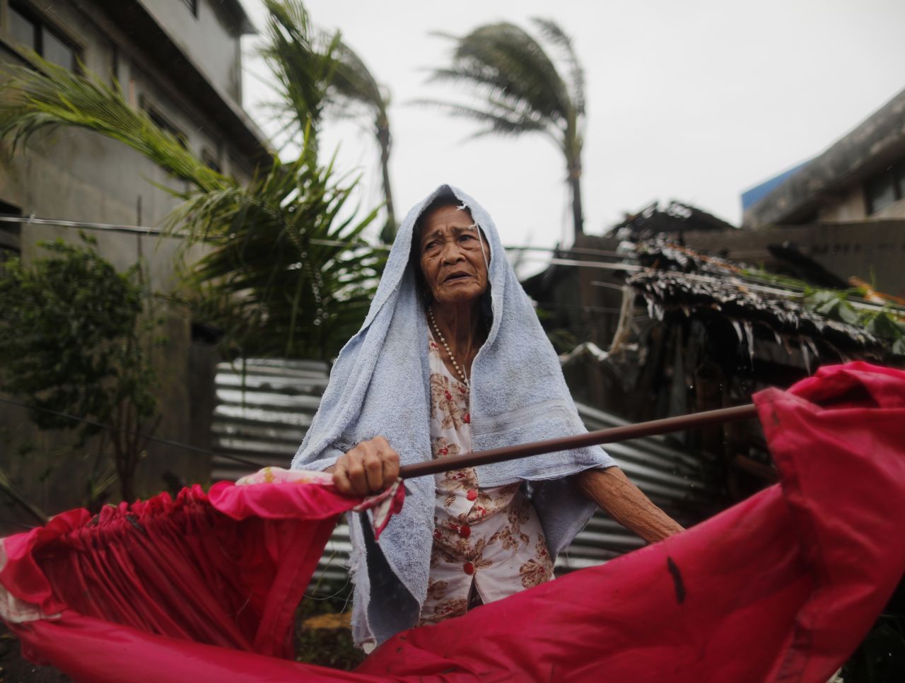 An elderly Filipino woman copes in the typhoon-hit town of Aparri, Philippines, on September 15.