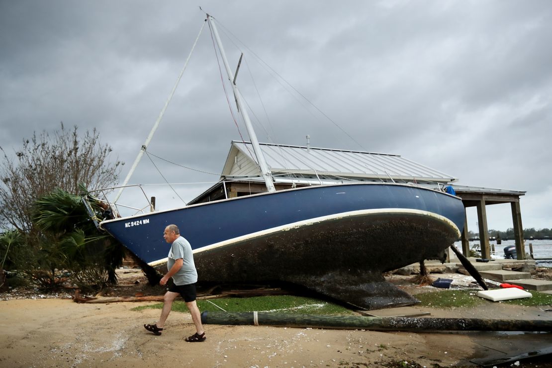 A sail boat lifted by the storm surge leans against a building at the destroyed Bridgepointe Marina a day after Hurricane Florence made landfall September 15, 2018 in New Bern, North Carolina.