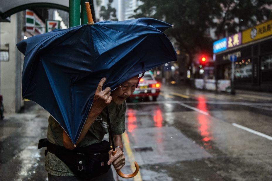 An elderly man waits for a taxi as Typhoon Mangkhut edges closer to Hong Kong, on Sunday, September 16.