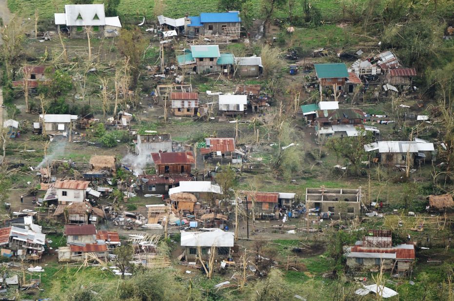 Debris from houses destroyed by Typhoon Mangkhut lay scattered on the ground in Tuguegarao city in northeastern Philippines, on Sunday, September 16.