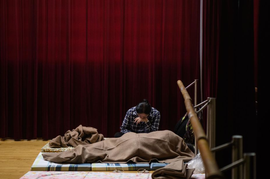 Hong Kong residents rest in a shelter on September 16.