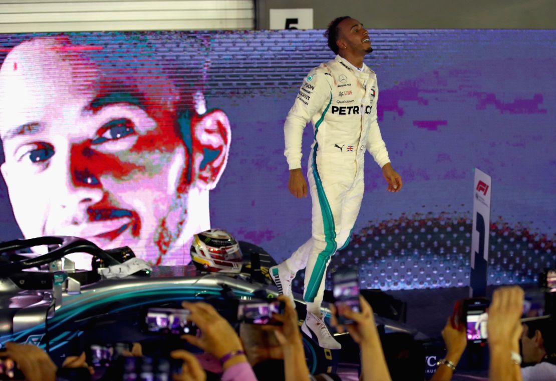 Lewis Hamilton celebrates after his brilliant victory in the Singapore Grand Prix.