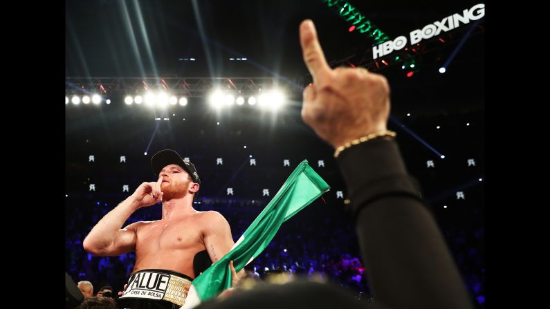 Canelo Alvarez poses with the championship belts after his majority decision win against Gennady Golovkin during their WBC/WBA middleweight title fight at T-Mobile Arena on Saturday, September 15.
