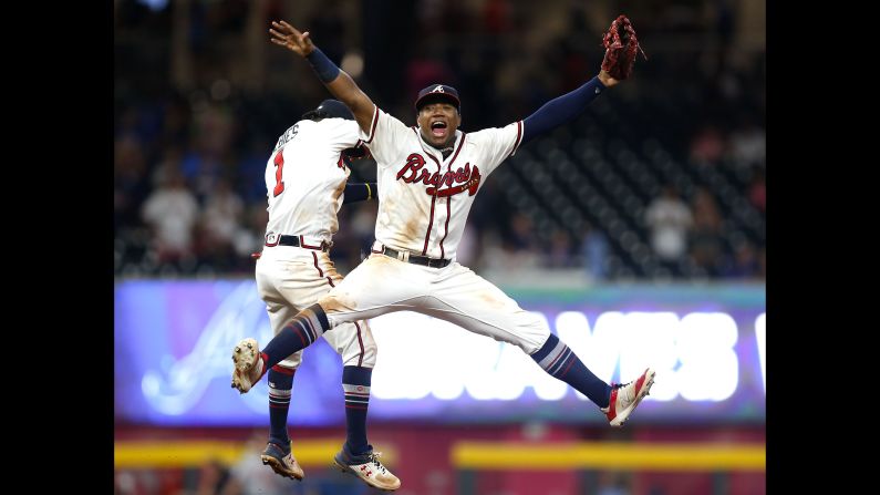Left fielder Ronald Acuna Jr. and second baseman Ozzie Albies of the Atlanta Braves celebrate after the game against the Washington Nationals at SunTrust Park in Atlanta, Georgia on Friday, September 14.
