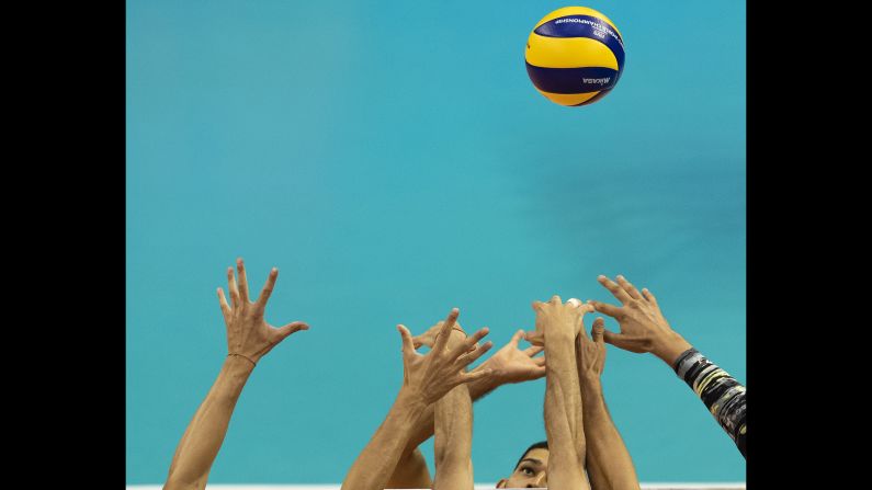 Volleyball players go for the ball during the match between Bulgaria and Puerto Rico in Varna, Bulgaria on Friday, September 14.