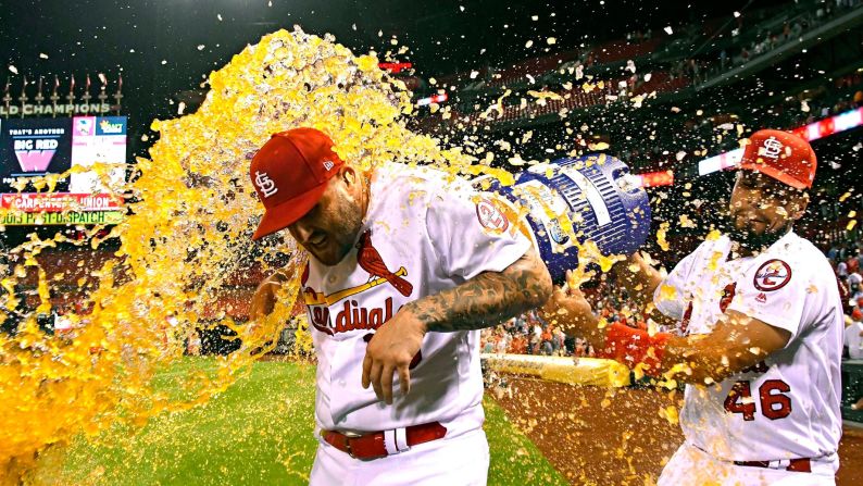 St. Louis Cardinals' Francisco Peña throws Gatorade on first baseman Matt Adams after the team's victory over the Pittsburgh Pirates at Busch Stadium on Monday, September 10.