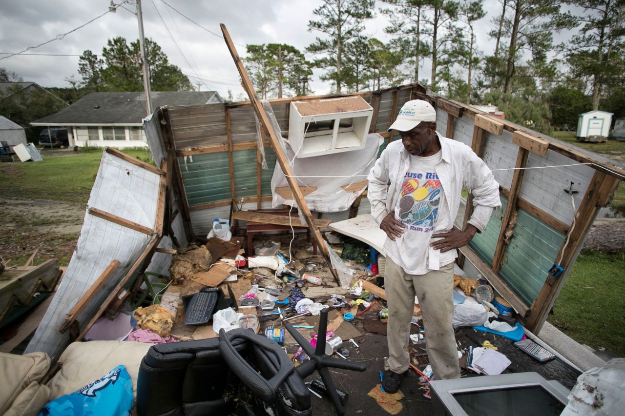 Tony Thompson stands in the wreckage of his mobile home as Florence moved inland over Newport, North Carolina, on September 16.