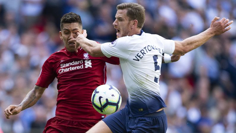 Roberto Firmino of Liverpool receives a finger in the eye from Jan Vertonghen of Tottenham Hotspur during the Premier League match at Wembley Stadium on Saturday, September 15.