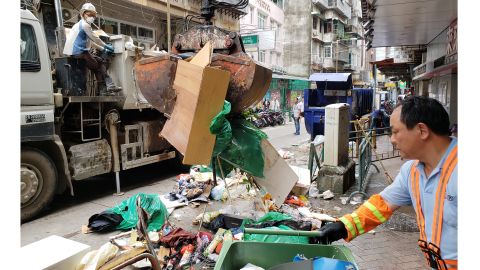 Crews work to remove debris and ruined goods on Monday, after Typhoon Mangkhut devastated Macau one day earlier.