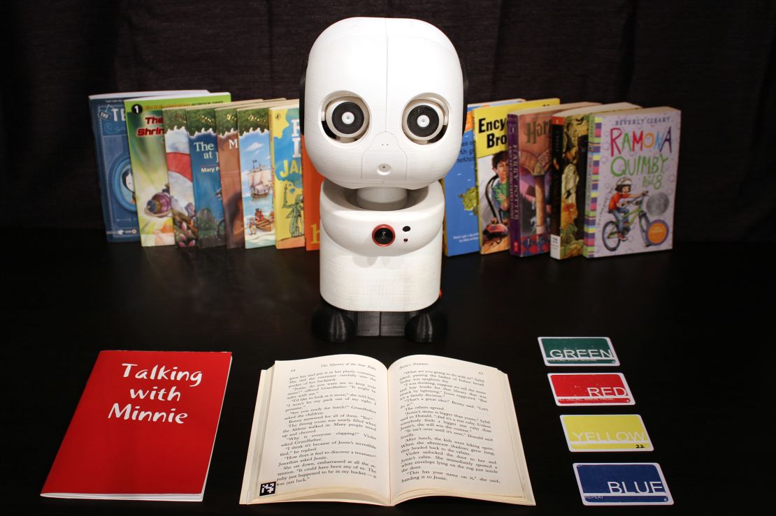 Minnie, a learning companion robot, listens and makes occasional comments while children read.